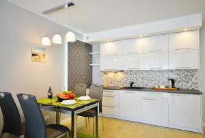 Kuchyň nebo kuchyňský kout v ubytování Grey & Green Apartments