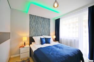 Postel nebo postele na pokoji v ubytování Grey & Green Apartments