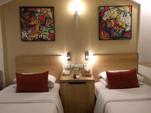 Voodi või voodid majutusasutuse Lemon Tree Hotel, Udyog Vihar, Gurugram toas