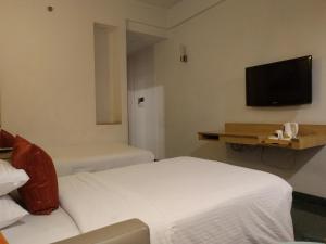 Televiisor ja/või meelelahutuskeskus majutusasutuses Lemon Tree Hotel, Udyog Vihar, Gurugram