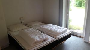 Postel nebo postele na pokoji v ubytování Lyngbjerggaard Ferieboliger - B&B