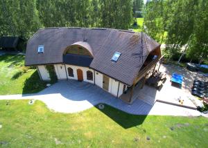an overhead view of a house with a roof at Piejūras Nams in Ķesterciems