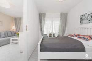 Posteľ alebo postele v izbe v ubytovaní Rezydencja Portowa 14 - Jantar Apartamenty