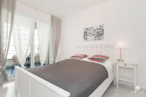 Posteľ alebo postele v izbe v ubytovaní Rezydencja Portowa 14 - Jantar Apartamenty