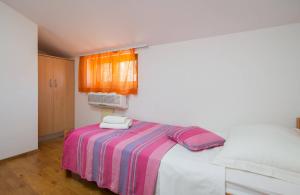 Postel nebo postele na pokoji v ubytování Apartments Judita