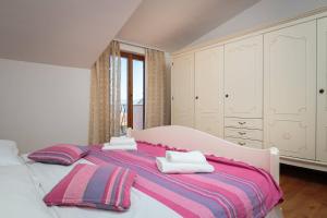 Ένα ή περισσότερα κρεβάτια σε δωμάτιο στο Apartments Judita