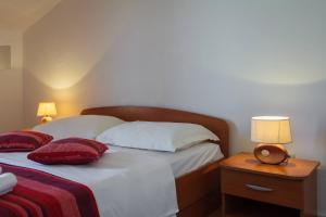 Postel nebo postele na pokoji v ubytování Apartments Judita