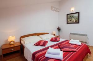 Postel nebo postele na pokoji v ubytování Apartments Judita