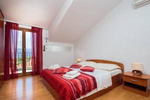 Postel nebo postele na pokoji v ubytování Apartments Judita