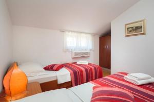 Postel nebo postele na pokoji v ubytování Apartments Judita