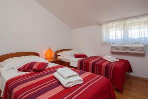 Postel nebo postele na pokoji v ubytování Apartments Judita