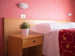 Postel nebo postele na pokoji v ubytování Hotel Junior