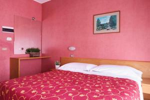 Postel nebo postele na pokoji v ubytování Hotel Junior