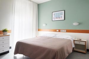 Postel nebo postele na pokoji v ubytování Hotel Junior