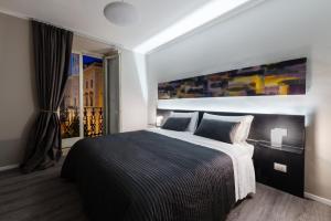 Postel nebo postele na pokoji v ubytování Residenza Navona Verona
