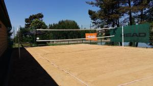 a tennis court with a net on top of it at Sportpenzion Pohoda in Pilsen