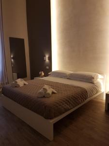 Postel nebo postele na pokoji v ubytování La Banchina Holiday Rooms