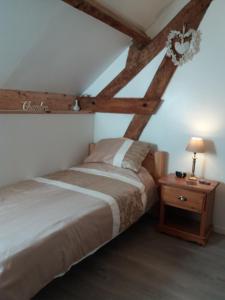 Voodi või voodid majutusasutuse Le Jarrier Apartment - Alpes Mancelles toas