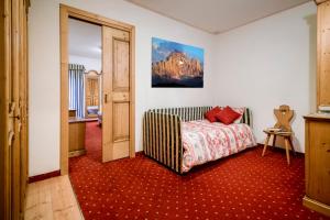 Postel nebo postele na pokoji v ubytování Hotel La Montanina