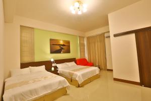 Tempat tidur dalam kamar di Chang Cheng Min Su