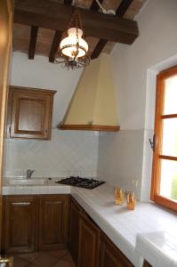 a kitchen with a sink and a stove top oven at Marinho in Cavo