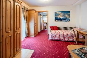 Postel nebo postele na pokoji v ubytování Hotel La Montanina