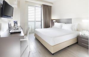 Postel nebo postele na pokoji v ubytování Hotel Cube + 37 fotografií