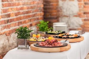 two plates of food sitting on a table at Queen Boutique Hotel in Krakow