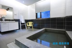 Kuchyň nebo kuchyňský kout v ubytování Green Life Spa Hot Spring Hotel