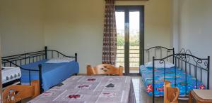 Postel nebo postele na pokoji v ubytování Dimitra Apartments