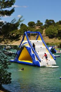 a group of people on a slide in the water at Nina in Carcassonne