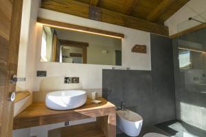 a bathroom with a white sink and a mirror at B&B Lo Matsòn in Chambave