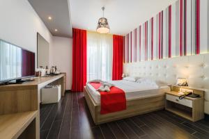 Posteľ alebo postele v izbe v ubytovaní Lagaria Hotel