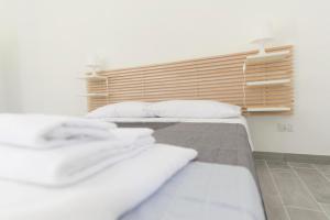 Posteľ alebo postele v izbe v ubytovaní Jardinu
