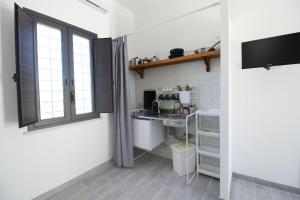 Kuchyňa alebo kuchynka v ubytovaní Jardinu