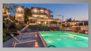 una grande piscina di fronte a un edificio di Milatos Village Cretan Agrotourism Hotel a Milatos