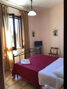 Postel nebo postele na pokoji v ubytování B&B Porticella