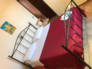 Postel nebo postele na pokoji v ubytování B&B Porticella