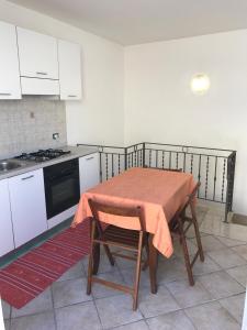 Kuchyň nebo kuchyňský kout v ubytování B&B Porticella
