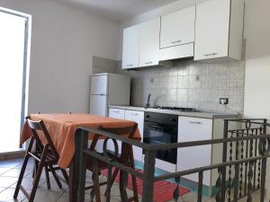 Kuchyň nebo kuchyňský kout v ubytování B&B Porticella