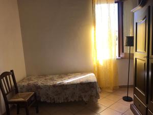 Postel nebo postele na pokoji v ubytování B&B Porticella
