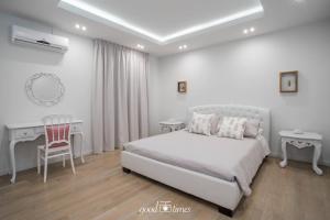 Postel nebo postele na pokoji v ubytování Pineapple Seaside Suite