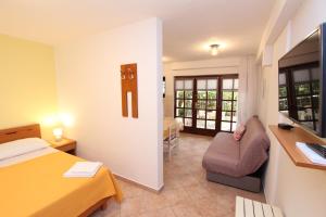 Posteľ alebo postele v izbe v ubytovaní Apartments Lara