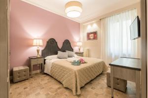 Posteľ alebo postele v izbe v ubytovaní Altarocca Embassy Rome