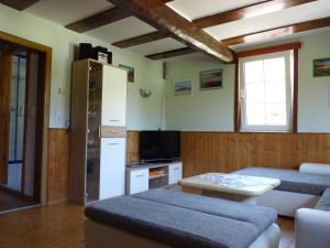 a living room with a couch and a table at Ferienhaus Katharina in Nothweiler