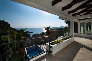 a balcony of a house with a view of the ocean at Villa Mia in Sveti Stefan