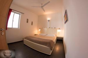 Ένα ή περισσότερα κρεβάτια σε δωμάτιο στο Cala da Lua apartments +183 φωτογραφίες