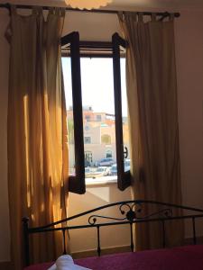 Postel nebo postele na pokoji v ubytování B&B Porticella