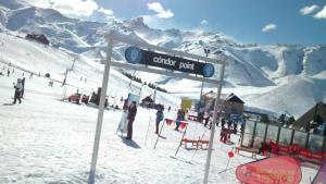 a sign for a ski resort on a snowy mountain at Rodas - Las Leñas in Las Lenas