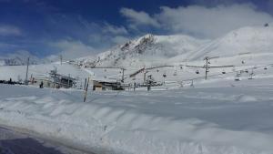 a snow covered ski slope with a ski lift at Rodas - Las Leñas in Las Lenas +15 photos